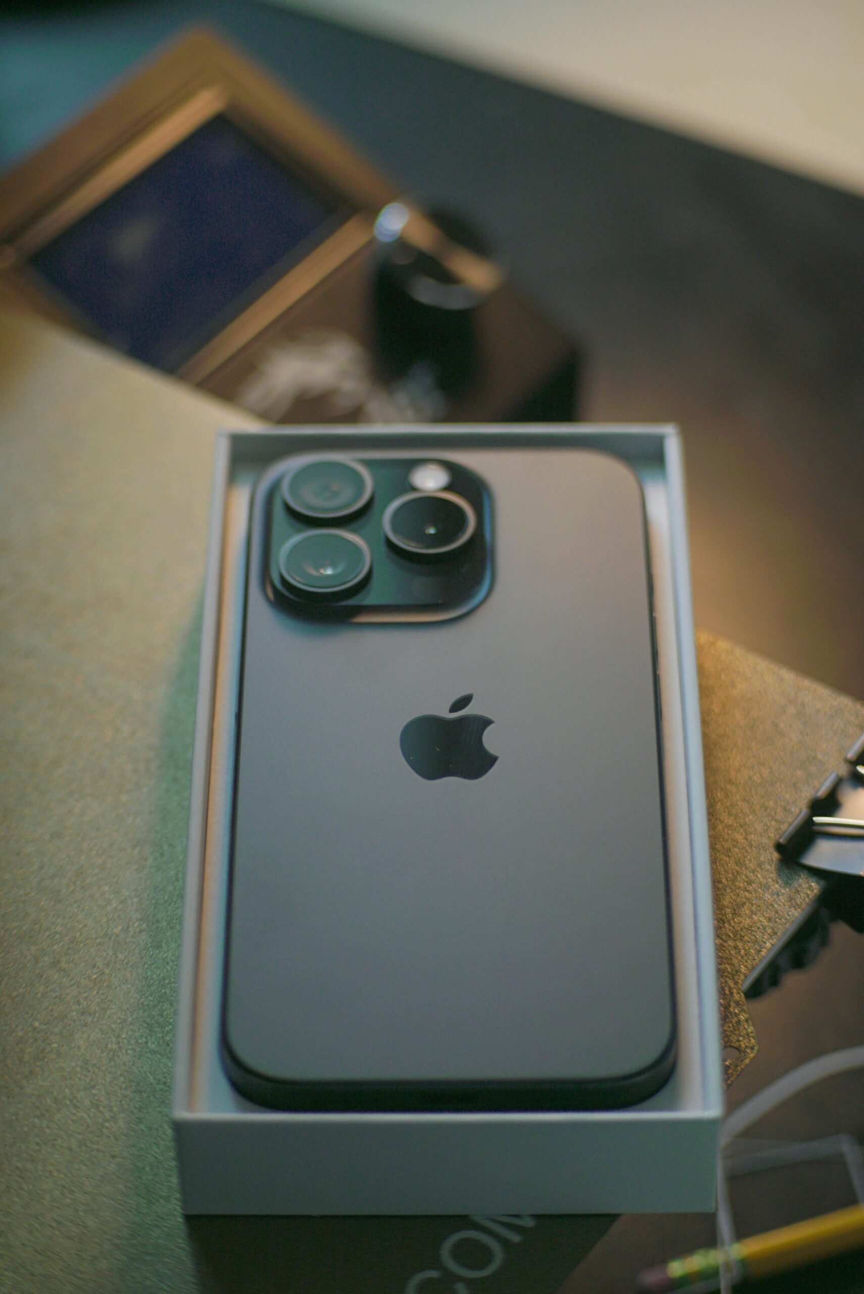 Close-up of a sleek smartphone in its box, showcasing modern technology and design.
